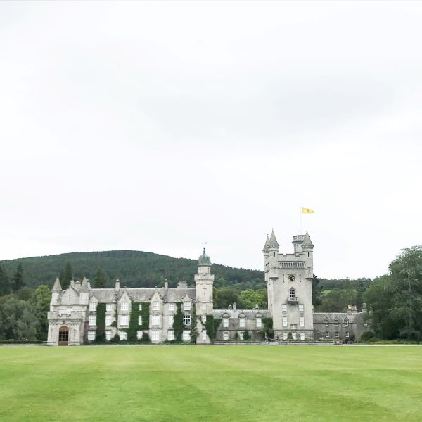 Mossy Castle on green lawn in Scotland